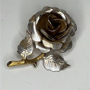 Vintage gold and silver tone rose brooch.